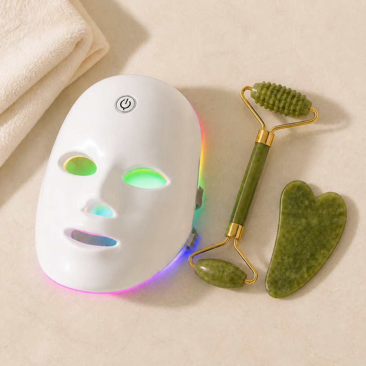 GlowWell Glow Essentials Kit flat lay with LED mask, jade roller and gua sha